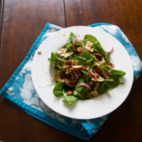 Ottolenghi's baby spinach salad with dates, almonds & crispy flatbread